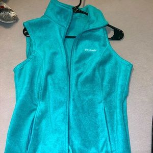 Gently used Columbia Vest. Vibrant teal color.